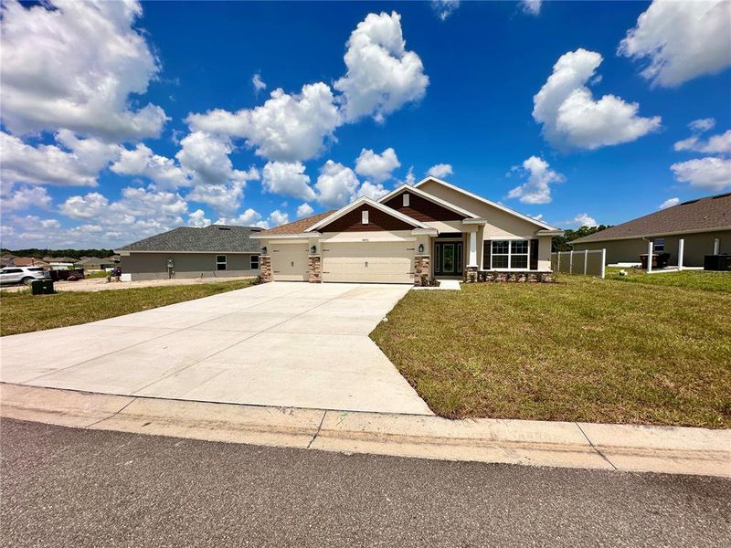 Front exterior of a new home in , Ocala, FL, highlighting curb appeal (Image 15). Front exterior of a new home in , Ocala, FL, highlighting curb appeal (Image 15).