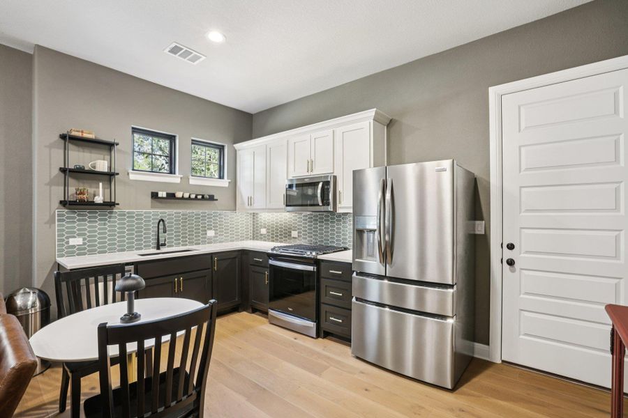 Designed for total independence and comfort, this fully private in-law space features a spacious living room separate from the main household, a full kitchen for culinary autonomy, a comfortable bedroom with a stylish bath, and its own dedicated laundry room.