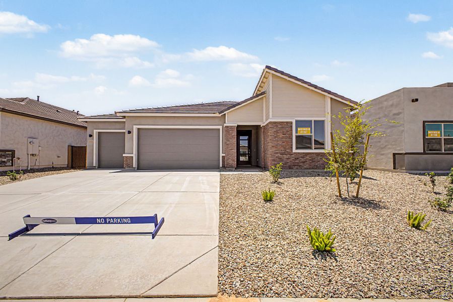 Front exterior of a new home in Landmarke, San Tan Valley, AZ, highlighting curb appeal (Image 1). Front exterior of a new home in Landmarke, San Tan Valley, AZ, highlighting curb appeal (Image 1).
