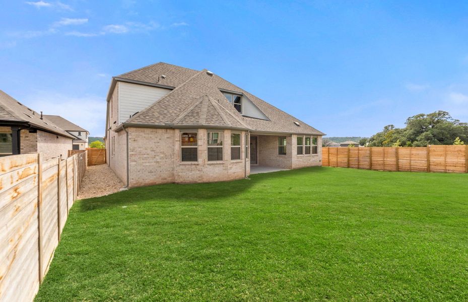 Exterior details and patio area of a home in Bluffview Reserve, Leander (Image 32).