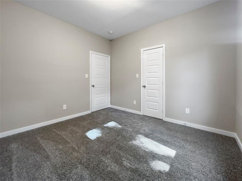 Spare room featuring carpet flooring