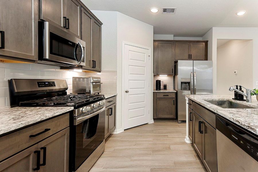 Upgraded Granite Countertops, Decorative Backsplash and Large Single Bowl Sink Upgraded Granite Countertops, Decorative Backsplash and Large Single Bowl Sink