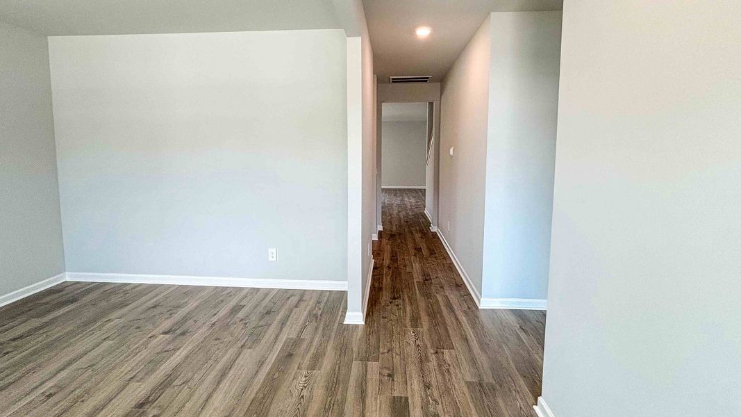 Representative unfurnished interior of a home built from the CALHOUN by D.R. Horton in Harvest Point, Spring Hill (Image 11).