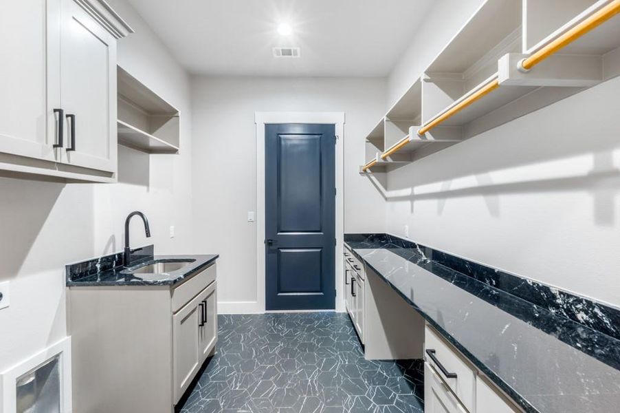 Laundry room featuring sink