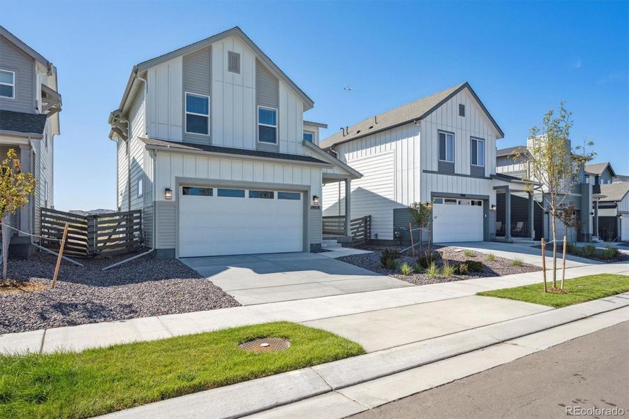Front exterior of a new home in Legato, Commerce City, CO, highlighting curb appeal (Image 2).