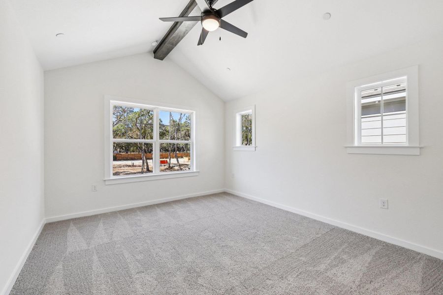 Empty room with carpet floors, plenty of natural light, and ceiling fan Empty room with carpet floors, plenty of natural light, and ceiling fan
