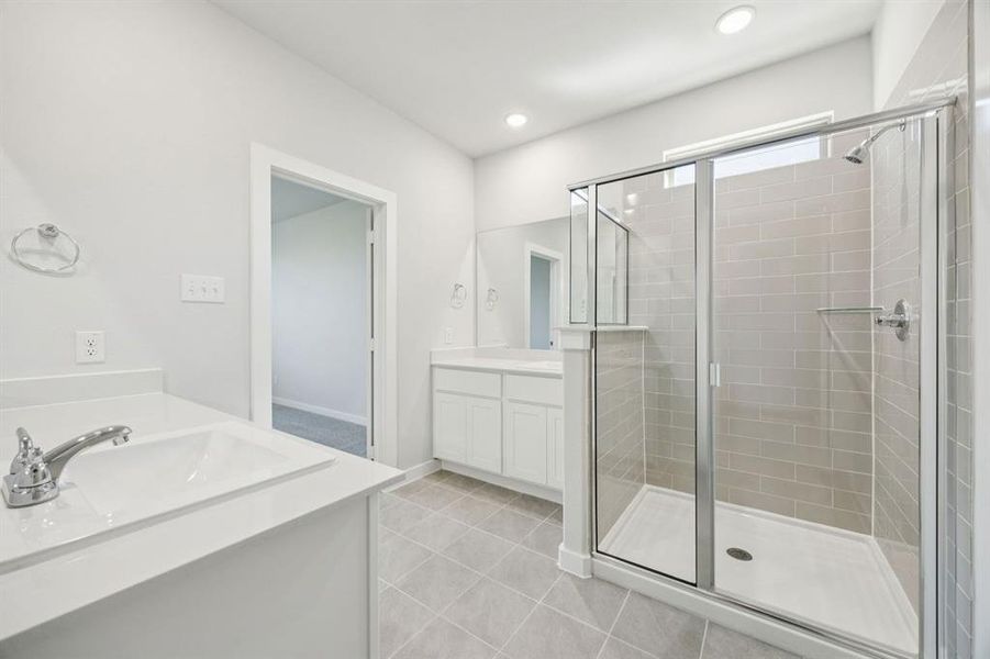 Primary Bathroom in the Masters home plan by Trophy Signature Homes – REPRESENTATIVE PHOTO Primary Bathroom in the Masters home plan by Trophy Signature Homes – REPRESENTATIVE PHOTO