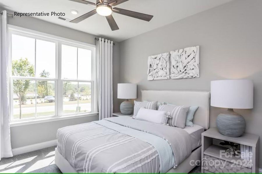 Private guest bedroom with a walk-in closet...