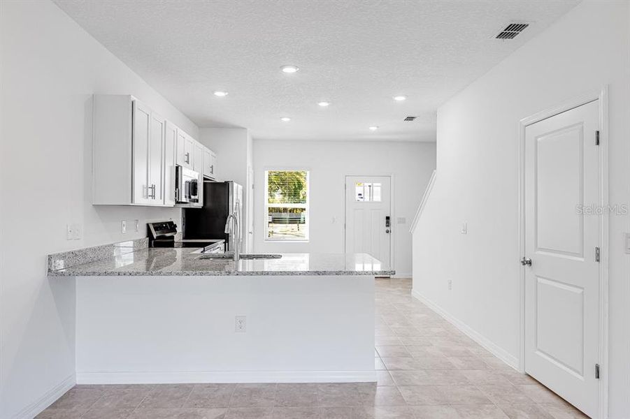 Furnished interior view inside a new home in The Townhomes at Westview, Kissimmee (Image 6).
