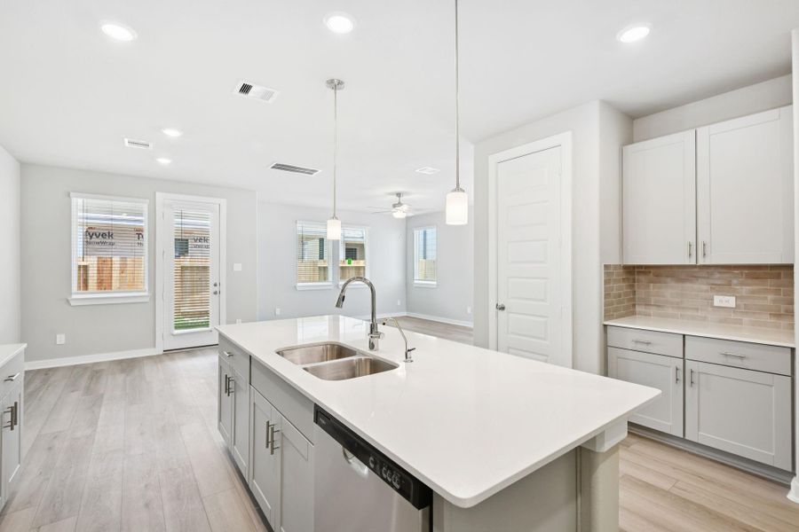 Photos are not of the actual home, but are photos of the builder home with same floorplan with similar interior finishes.