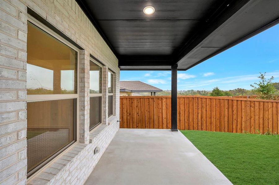 Exterior details and patio area of a home in Aspire at Noble Ridge, Howe (Image 23).