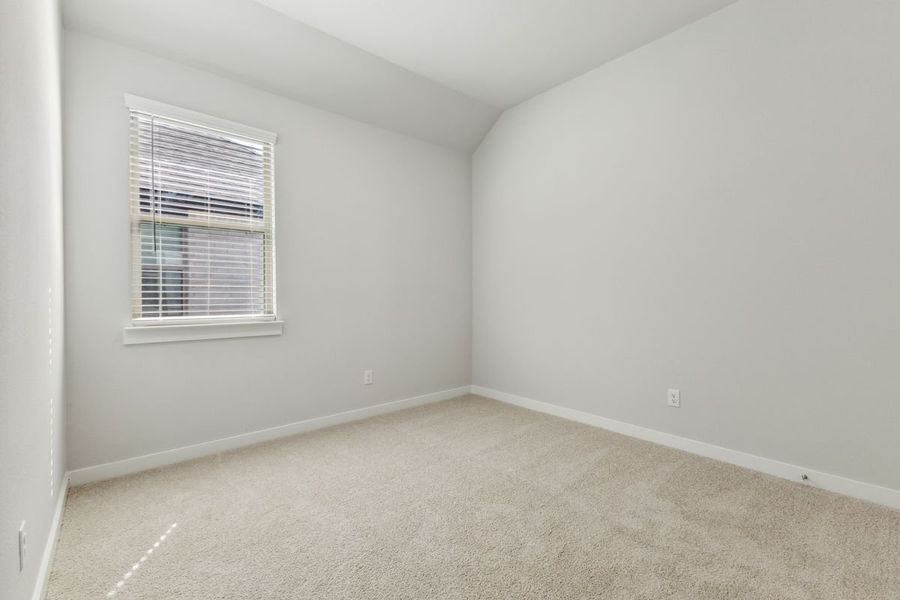 Bedroom in the Cedar home plan by Trophy Signature Homes – REPRESENTATIVE PHOTO