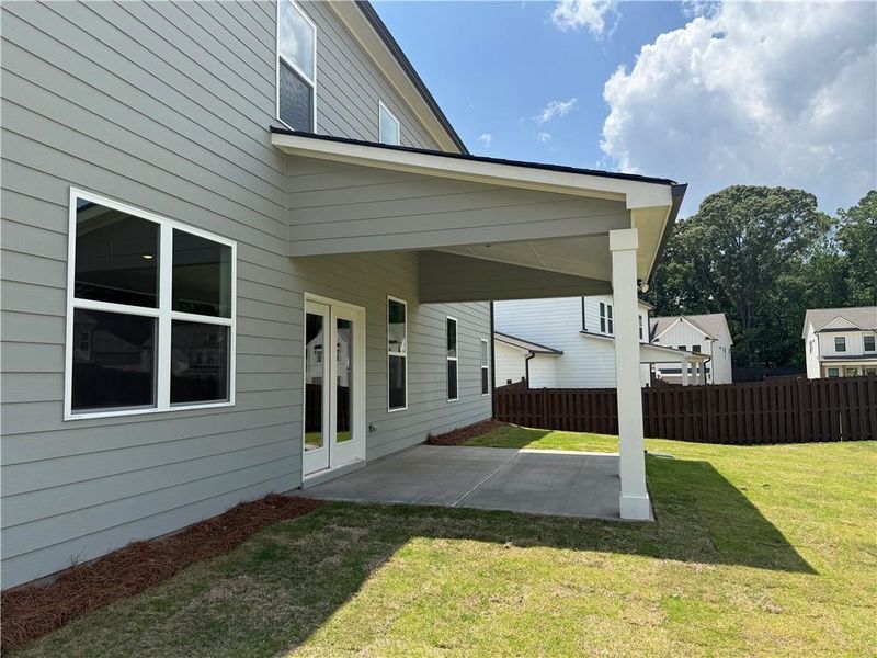 Exterior details and patio area of a home in Rosewood Lake Estates, Hoschton (Image 21).