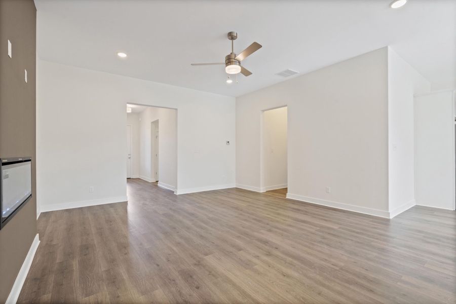 Unfurnished living room featuring recessed lighting, a ceiling fan, and light wood finished floors
