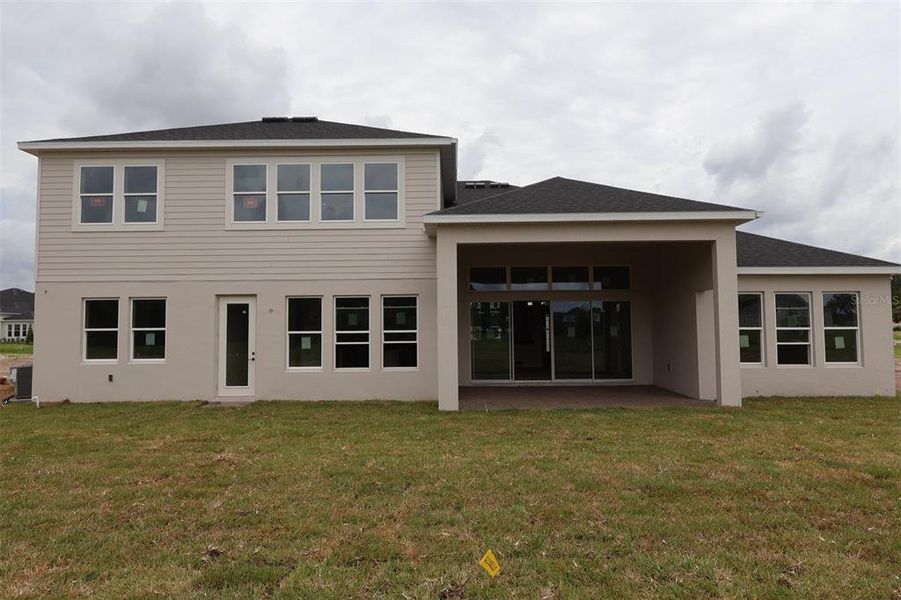 Exterior details and patio area of a home in Solace at Corner Lake, Orlando (Image 3). Exterior details and patio area of a home in Solace at Corner Lake, Orlando (Image 3).