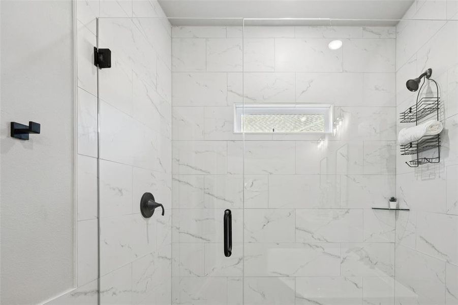 Full bathroom featuring a stall shower