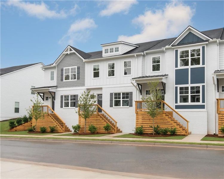 Front exterior of a new home in Old Salem Crossing, Conyers, GA, highlighting curb appeal (Image 2). Front exterior of a new home in Old Salem Crossing, Conyers, GA, highlighting curb appeal (Image 2).