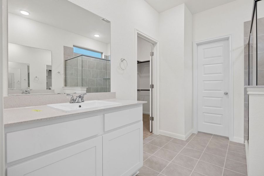 Primary Bath in the Elm home plan by Trophy Signature Homes – REPRESENTATIVE PHOTO