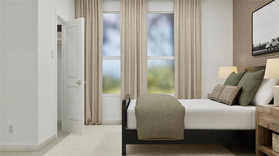 Bedroom with baseboards and light carpet
