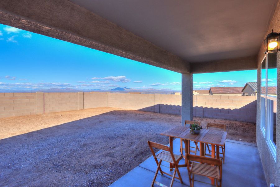 A table and chairs on a deck. A table and chairs on a deck.