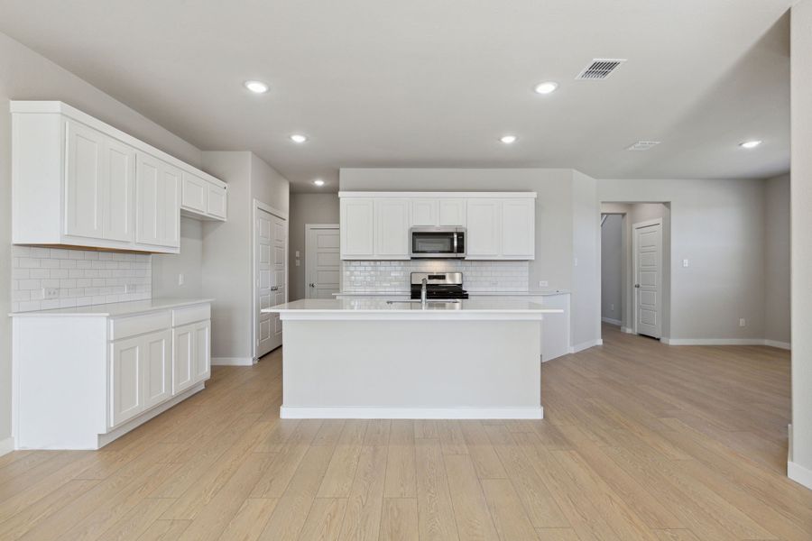 Kitchen in the Oak home plan by Trophy Signature Homes – REPRESENTATIVE PHOTO