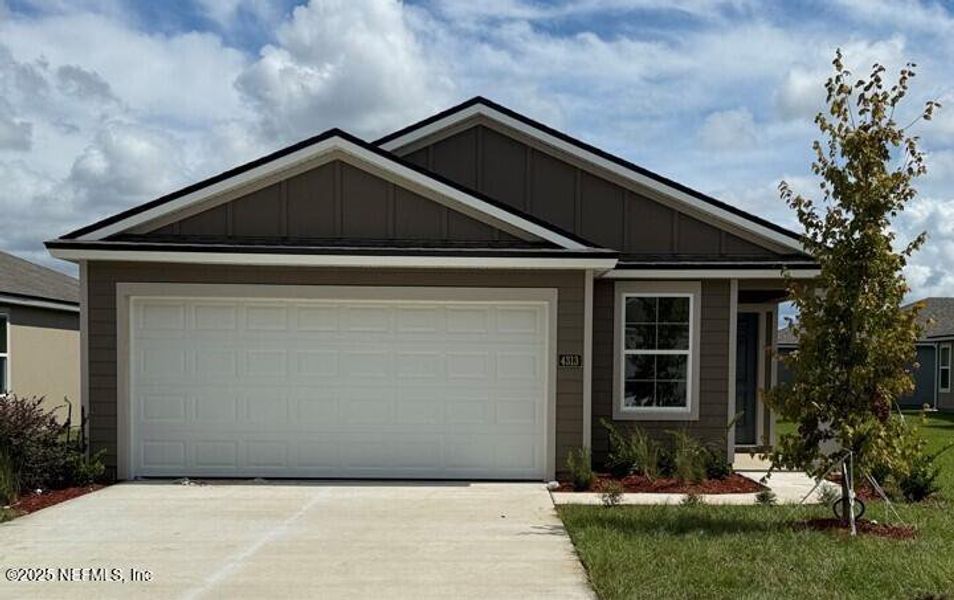 Front exterior of a new home in The Arbors, Jacksonville, FL, highlighting curb appeal (Image 2). Front exterior of a new home in The Arbors, Jacksonville, FL, highlighting curb appeal (Image 2).
