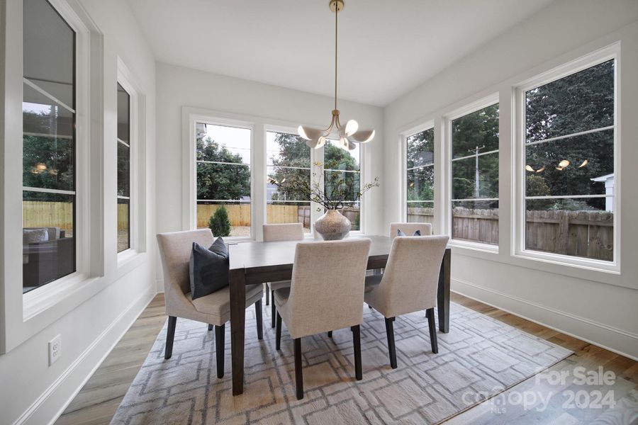 Amazing sun soaked dining area with 270 degrees of windows.