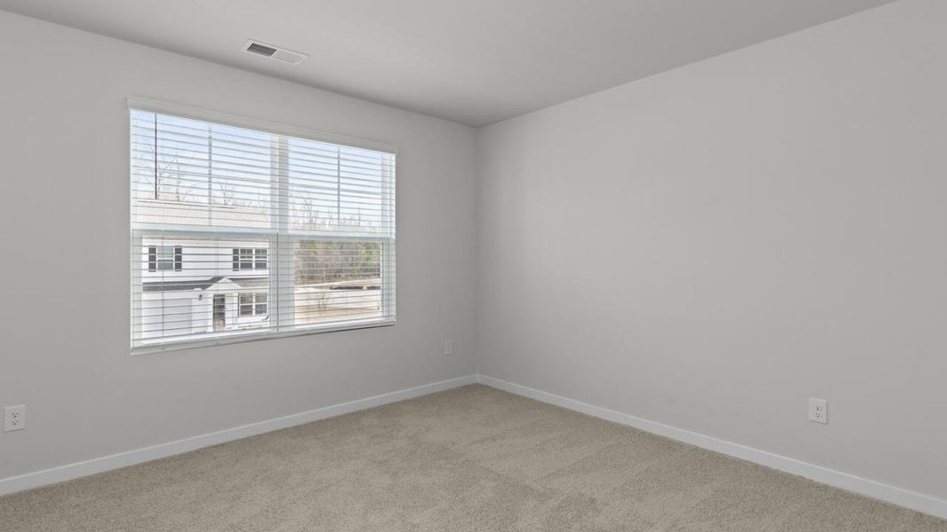 Spacious, unfurnished interior of a new home in Sidbury Station, Castle Hayne (Image 32).