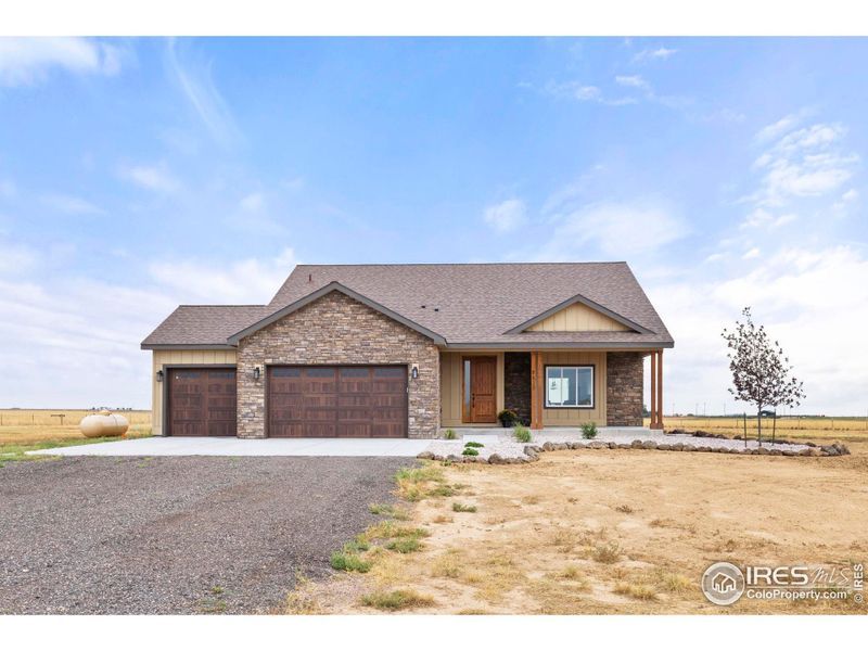 Front exterior of a new home in , Nunn, CO, highlighting curb appeal (Image 2).