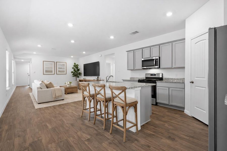 Open concept spaces offer flexibility for designing your ideal living and dining areas while the kitchen is modern and ready to use. (virtually staged photo) Open concept spaces offer flexibility for designing your ideal living and dining areas while the kitchen is modern and ready to use. (virtually staged photo)