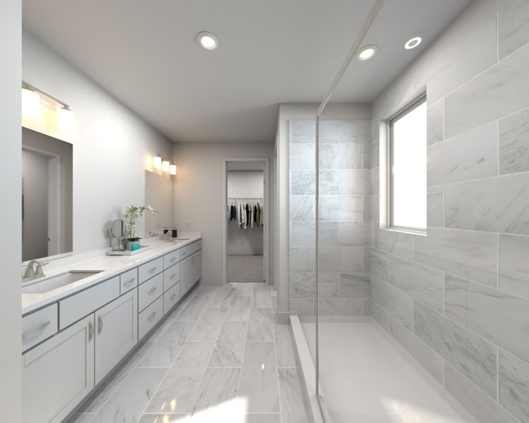 The primary bathroom offers dual vanity sinks and a walk-in shower. The primary bathroom offers dual vanity sinks and a walk-in shower.