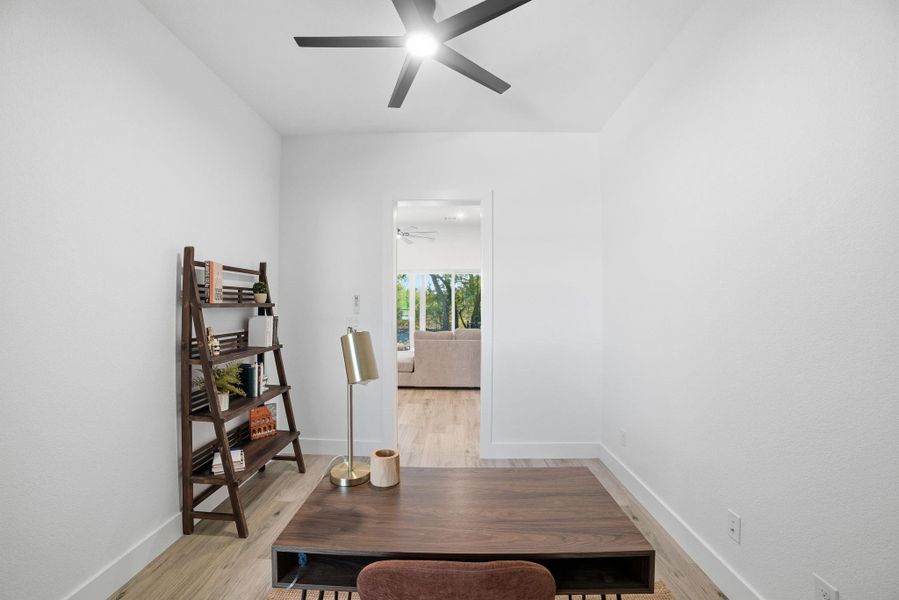 Office area featuring light wood-style floors and baseboards Office area featuring light wood-style floors and baseboards