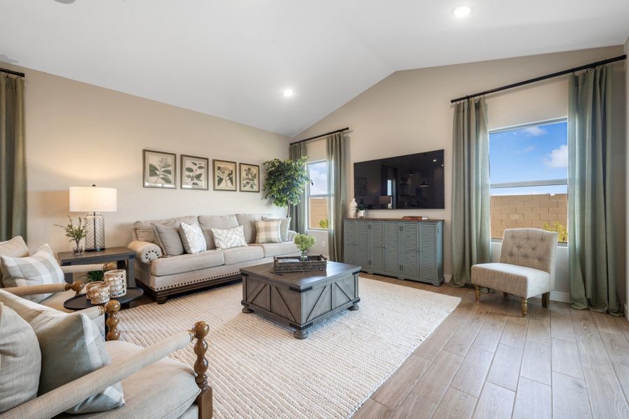 Great room with vaulted ceiling and wood-look tile floor