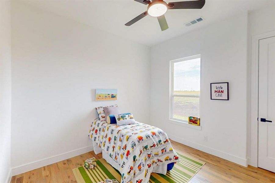 Bedroom featuring ceiling fan and light hardwood / wood-style floors