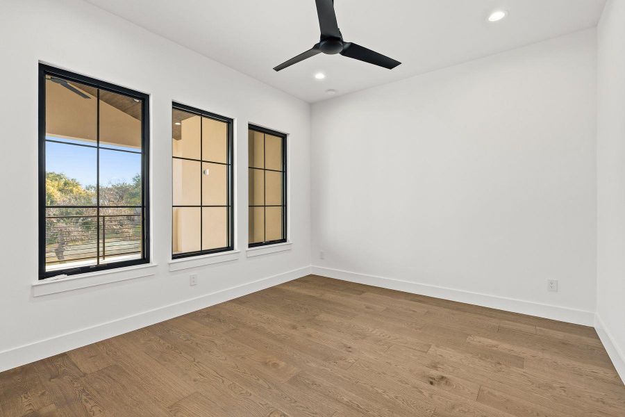 Spare room with wood finished floors, recessed lighting, and ceiling fan