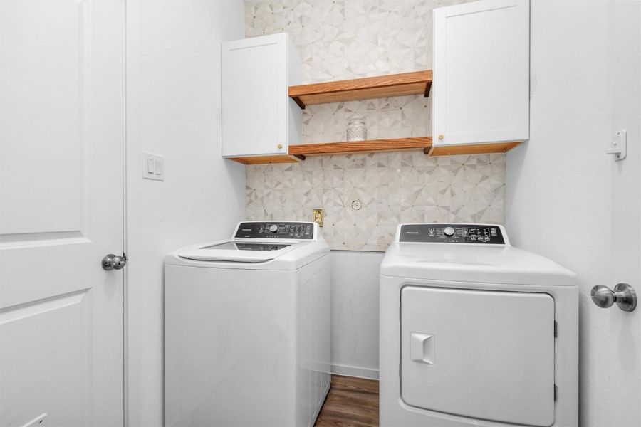 Utility area with built-ins. Electric dryer connection