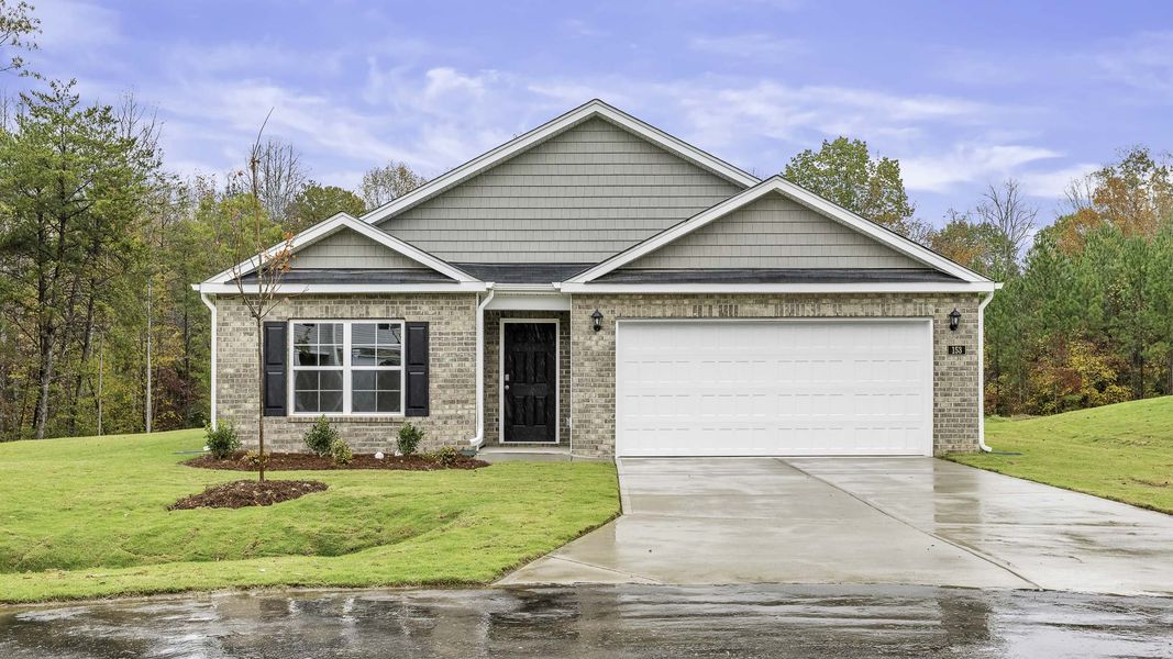 Front exterior of a new home in Foxtail, Yadkinville, NC, highlighting curb appeal (Image 1). Front exterior of a new home in Foxtail, Yadkinville, NC, highlighting curb appeal (Image 1).