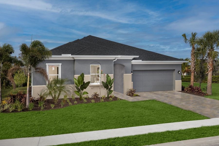 Front exterior of a home in the Coves of Estero Bay community, located in Fort Myers, FL (Image 13).
