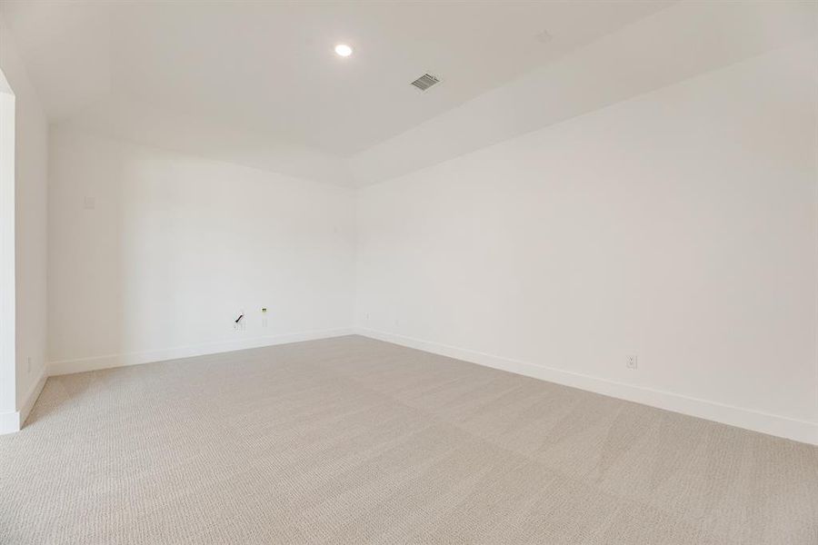 Empty room featuring recessed lighting and light colored carpet Empty room featuring recessed lighting and light colored carpet