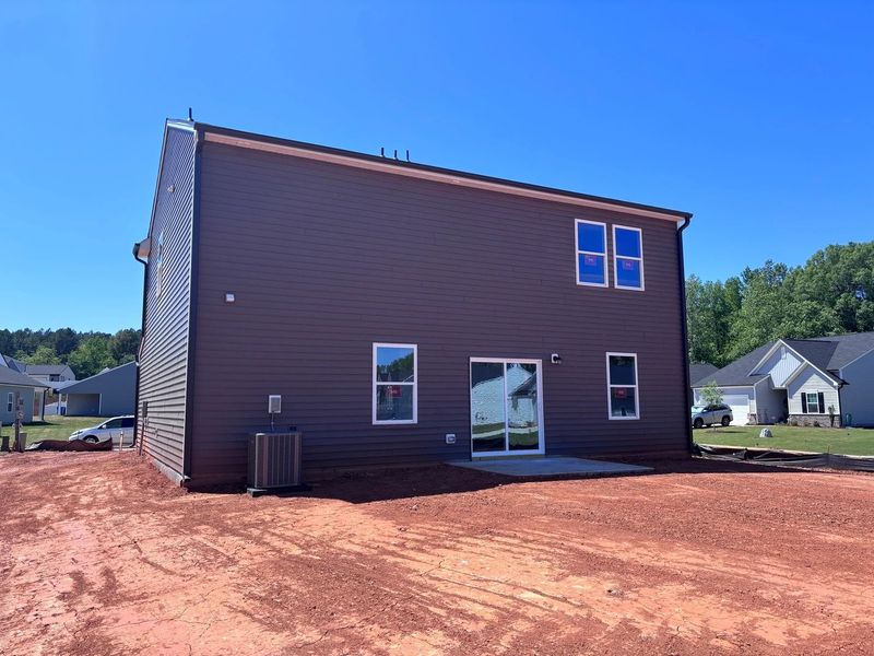 Exterior details and patio area of a home in Middleton Farms, Middlesex (Image 8).