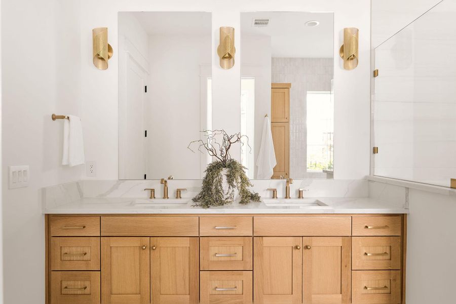 Bathroom featuring double vanity Bathroom featuring double vanity