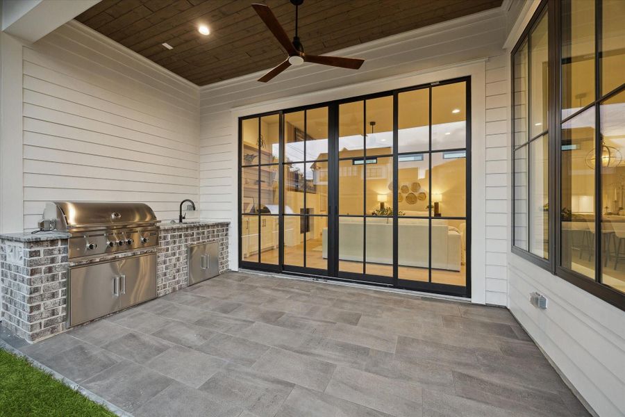 Outdoor living with outdoor kitchen.