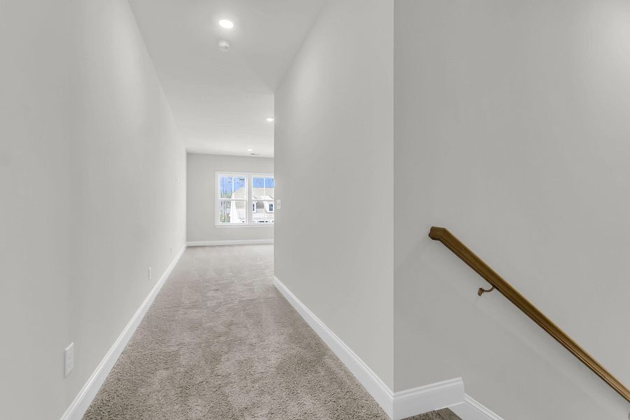 Spacious, unfurnished interior of a new home in Tidewater at Lakes of Cane Bay, Summerville (Image 30).