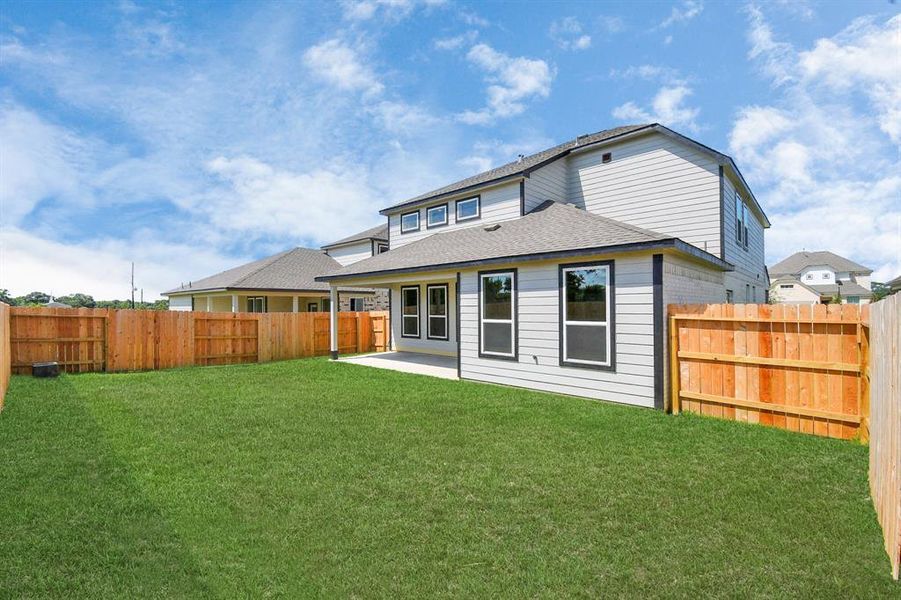 Ample room for both play and relaxation, it's the perfect outdoor haven. Tailor this space to your liking with patio furniture, a BBQ pit, and more. The potential for creating your dream outdoor living area is limitless! Sample photo of completed home. Actual colors and selections may vary.