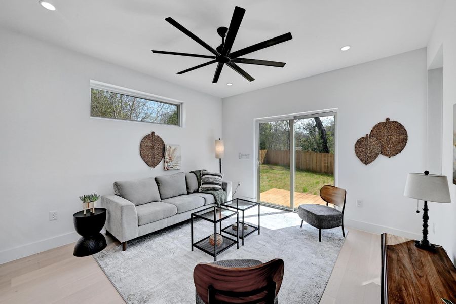 Living area featuring recessed lighting, wood finished floors, and a ceiling fan