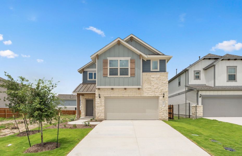 Front exterior of a new home in Santa Rita Ranch, Liberty Hill, TX, highlighting curb appeal (Image 20).