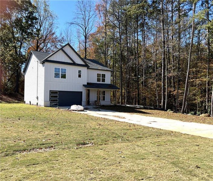 Front exterior of a new home in , Lithonia, GA, highlighting curb appeal (Image 1).