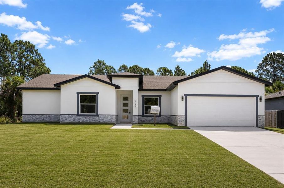 Front exterior of a new home in , Palm Bay, FL, highlighting curb appeal (Image 23).