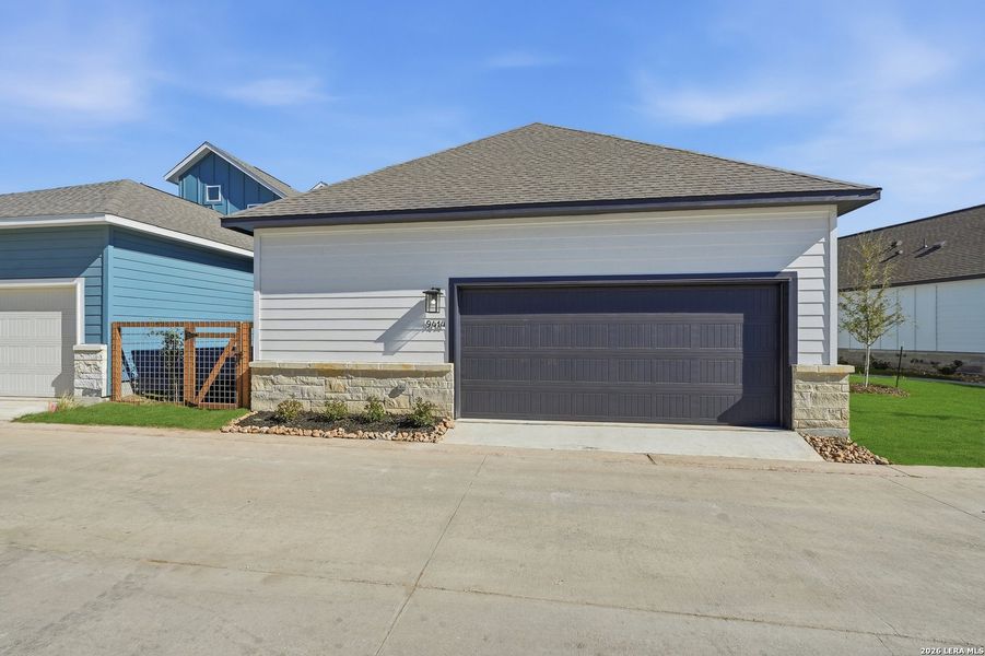 Front exterior of a new home in The Crossvine, Schertz, TX, highlighting curb appeal (Image 22).