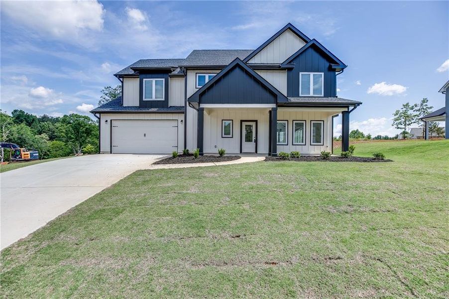 Front exterior of a new home in , Toccoa, GA, highlighting curb appeal (Image 31). Front exterior of a new home in , Toccoa, GA, highlighting curb appeal (Image 31).